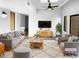 Bright living room with a ceiling fan, skylight, modern furnishings, and neutral decor at 5780 Par Four Ct, Lithonia, GA 30038