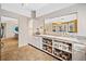 Kitchen area featuring eat-in bar with storage and view into the Gathering and dining rooms at 2323 River Station Ter, Woodstock, GA 30188