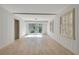 Finished basement with white walls, neutral floors, two shuttered windows and a glass sliding door at 355 Ridgeview Trl, Atlanta, GA 30328