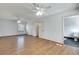 Spacious bedroom with hardwood floors, closet, ceiling fans, and an attached bathroom at 355 Ridgeview Trl, Atlanta, GA 30328