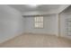 Finished basement bedroom with white walls, neutral floors, one shuttered windows and closet space at 355 Ridgeview Trl, Atlanta, GA 30328