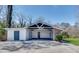Spacious carport featuring room for two vehicles with an attached storage room at 355 Ridgeview Trl, Atlanta, GA 30328