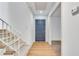 Bright entryway with hardwood floors, a staircase, and a view into the home's interior at 355 Ridgeview Trl, Atlanta, GA 30328