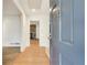 Inviting entryway featuring hardwood floors and a glimpse into a living area with a fireplace at 355 Ridgeview Trl, Atlanta, GA 30328