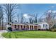 Charming ranch-style home with a well-manicured lawn, brick facade, and attached carport at 355 Ridgeview Trl, Atlanta, GA 30328