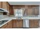 Updated kitchen with stainless steel dishwasher, oven and cooktop, and ample counter space at 355 Ridgeview Trl, Atlanta, GA 30328