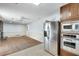 Open concept design of the kitchen and living room with stainless steel appliances, wood floors, and ample space at 355 Ridgeview Trl, Atlanta, GA 30328