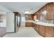 Functional kitchen featuring stainless steel appliances, wooden cabinets, and durable countertops at 355 Ridgeview Trl, Atlanta, GA 30328