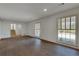 Spacious room featuring hardwood floors, natural light and view of the staircase to the second floor at 355 Ridgeview Trl, Atlanta, GA 30328