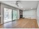 Cozy room featuring a fireplace, hardwood floors, and sliding glass doors that provide a seamless transition to the outdoors at 355 Ridgeview Trl, Atlanta, GA 30328