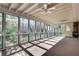 Relaxing screened-in porch with multiple windows and ceiling fans for enjoying the outdoors at 355 Ridgeview Trl, Atlanta, GA 30328
