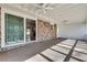 View of the screened-in porch with brick wall and the access to the house through sliding glass doors at 355 Ridgeview Trl, Atlanta, GA 30328