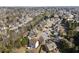 Aerial shot showcases a quiet neighborhood with well-spaced houses surrounded by trees at 1471 Adair Hill Ct, Dacula, GA 30019