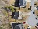 Overhead view of a well-kept home with a neat lawn, driveway, and surrounding neighborhood at 1471 Adair Hill Ct, Dacula, GA 30019