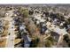 An aerial view of a peaceful residential area with neatly arranged homes and tree-lined streets at 1471 Adair Hill Ct, Dacula, GA 30019