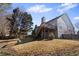 A fenced yard with a two-story house and stairs leading up to a deck at 1471 Adair Hill Ct, Dacula, GA 30019