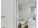 Bright bathroom features a shower-tub combination and white vanity at 1471 Adair Hill Ct, Dacula, GA 30019