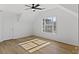 Light-filled bedroom with ceiling fan and large window at 1471 Adair Hill Ct, Dacula, GA 30019
