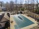 Community pool area featuring a large covered pool with a pergola and picnic table at 1471 Adair Hill Ct, Dacula, GA 30019