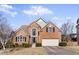 Charming two-story brick home with a well-manicured lawn and attached two-car garage at 1471 Adair Hill Ct, Dacula, GA 30019