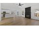 Spacious living room and kitchen area with modern appliances, fireplace, high ceilings, and an open floor plan at 1471 Adair Hill Ct, Dacula, GA 30019