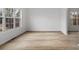 Bright living room with large windows, natural light, and hardwood floors at 1471 Adair Hill Ct, Dacula, GA 30019