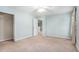 A bedroom with light blue walls, carpet and a closet with a white door at 939 Mill Creek Ave, Canton, GA 30115