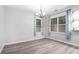 Bright dining area with natural light, chandelier, and grey flooring at 939 Mill Creek Ave, Canton, GA 30115