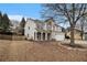 Two-story home showcasing a blend of white siding and stone accents, with a well-kept lawn and a two-car garage at 939 Mill Creek Ave, Canton, GA 30115