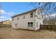 Backyard featuring raised garden beds and the rear exterior of the house at 939 Mill Creek Ave, Canton, GA 30115