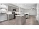 Modern kitchen with grey cabinets, island, stainless steel appliances, and open layout at 939 Mill Creek Ave, Canton, GA 30115