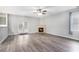Spacious living room with fireplace, ceiling fan, and access to the outdoor at 939 Mill Creek Ave, Canton, GA 30115