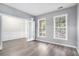 Living Room with wood-look floors, freshly painted walls, and plenty of natural light at 939 Mill Creek Ave, Canton, GA 30115