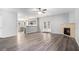 Spacious living room with fireplace, ceiling fan, and open layout at 939 Mill Creek Ave, Canton, GA 30115