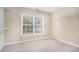 Walk-in closet with built-in shelving and a window for natural light at 939 Mill Creek Ave, Canton, GA 30115