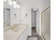 Beautiful bathroom featuring double sinks, stunning gold fixtures, and a tiled shower at 1655 Pine Ridge Cir, Woodstock, GA 30188