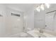 Bright bathroom featuring a vanity, framed mirror, and shower-tub combo at 1655 Pine Ridge Cir, Woodstock, GA 30188