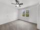 Bright bedroom with ceiling fan, natural light and carpeted floor at 1655 Pine Ridge Cir, Woodstock, GA 30188