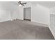 Vaulted bedroom with modern ceiling fan, neutral decor, and built-in shelves at 1655 Pine Ridge Cir, Woodstock, GA 30188