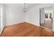 Dining room featuring hardwood floors, a modern chandelier, and a view into the adjoining rooms at 1655 Pine Ridge Cir, Woodstock, GA 30188
