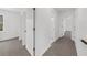 Hallway with access to bedrooms and bath at 1655 Pine Ridge Cir, Woodstock, GA 30188