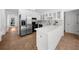 Updated kitchen with large island, stainless appliances, and tile flooring at 1655 Pine Ridge Cir, Woodstock, GA 30188