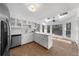Bright kitchen with stainless steel appliances and modern fixtures at 1655 Pine Ridge Cir, Woodstock, GA 30188