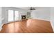 Bright living room featuring a fireplace, French doors, and hardwood floors at 1655 Pine Ridge Cir, Woodstock, GA 30188