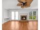 Cozy living room with fireplace, French doors, and large windows for natural light at 1655 Pine Ridge Cir, Woodstock, GA 30188