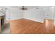 Open concept living area showcasing hardwood floors, fireplace, and wainscoting detail at 1655 Pine Ridge Cir, Woodstock, GA 30188