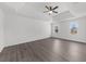 Main bedroom with tray ceilings, ceiling fan and abundant natural light at 1655 Pine Ridge Cir, Woodstock, GA 30188