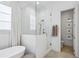 Bright bathroom featuring a glass shower, soaking tub, and neutral decor at 231 Chastain Park Dr, Atlanta, GA 30342