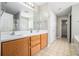 Bathroom features a double sink vanity, large mirror, and walk-in closet at 3272 Tiara Sw Cir, Atlanta, GA 30311