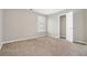 This bedroom features neutral walls, carpeted floors, and a window that allows natural light into the room at 3272 Tiara Sw Cir, Atlanta, GA 30311